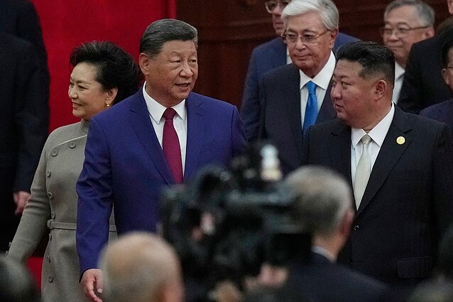 Xi Jinpingas ir Kim Jong Unas